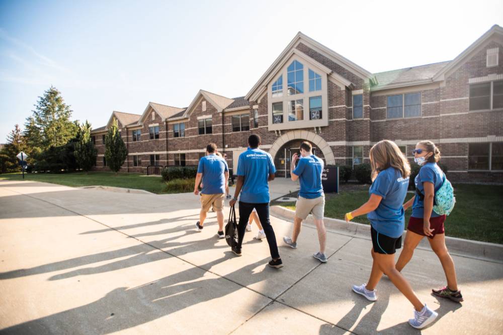 Alumni walking on GVSU campus